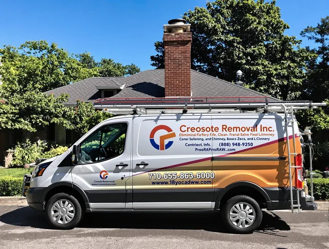Norfolk Chimney Sweep technician removing creosote safely in Norfolk, MA