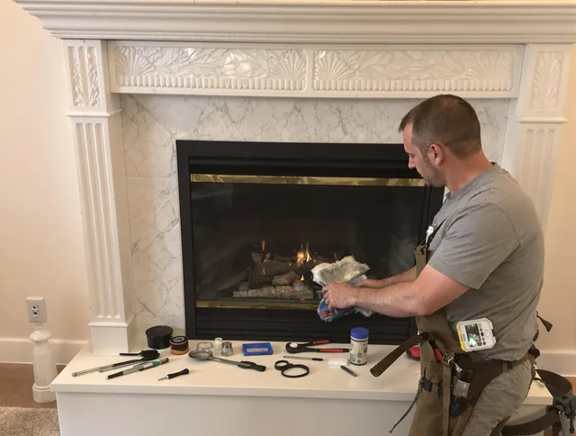 Norfolk Chimney Sweep performing fireplace maintenance in Norfolk, MA